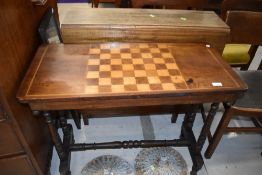 A Victorian games table, on turned frame, width approx. 83cm