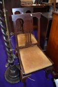 Two early 20th dining chairs having upholstered seats