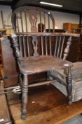 A traditional oak windsor armchair
