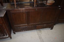 A period oak kist having three panel over double drawer base, dimensions approx. W122cm D52cm H78cm