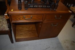 A mid to late 20th Century oak hifi or similar sideboard, having half cupboard and half shelved