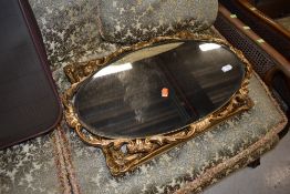 A vintage gilt frame oval mirror and a gilt picture frame