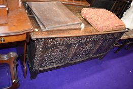 A period oak coffer/kist , having carved panel decoration, dimensions approx. W138cm D58cm H69cm