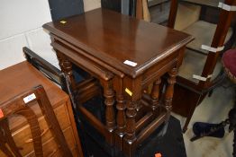 A lovely quality reproduction (Reprodux) nest of three traditional oak tables, in excellent