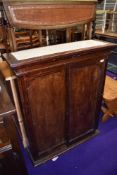 A stained frame panel cupboard, with tiled top