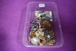 A small selection of costume jewellery earrings and brooches including slate and scenic