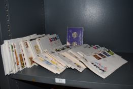 A selection of philatelic first day stamp covers and sets