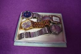 Four fashion wrist watches bearing names Rolex, Timex and Gucci
