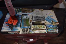 A suitcase full of vintage postcards,upwards of 1000 approximately, a a real mixture of eras and