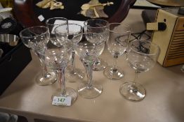 Two Victorian etched wine glasses, one with star and similar patters and the other ferns, also