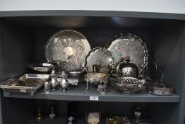 A selection of silver plate including domed butter dish, salvers, table basket, cruet, flatware,