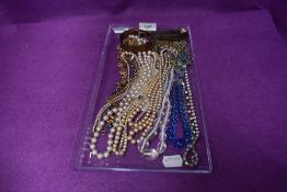 A selection of costume jewellery including white metal chain, beads, bangles etc