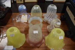 A collection of nine antique lamp shades including Uranium/Vaseline glass and similar, some