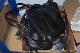 A mixed collection of ladies handbags, including brands such as Laura Ashley.