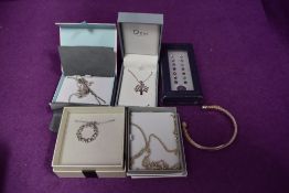 A small selection of silver and white metal jewellery including chains, pendant, earrings and