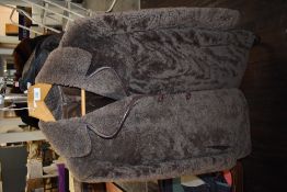 A vintage sheepskin coat having button front and pockets to sides,medium size.