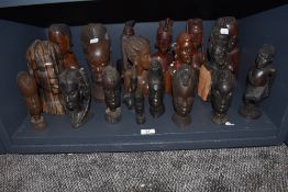 An impressive selection of hand carved African tribal heads and totems including Ghana, Maasai and