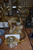 A continental onyx or similar clock having ormolu mounts, cherub detail and lion head handles to