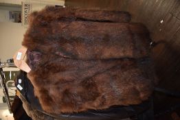 A 1940s fur cape having utility label,fully lined.