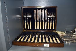 An oak canteen of Fish cutlery missing one knife.