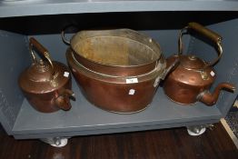 A selection of fire side copper wares including large stove kettles and twin handle bain marie