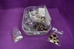 A box of costume jewellery including earrings, cufflinks and bangles