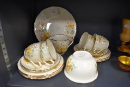 A part tea service by Alfred Meakin having transfer posy design