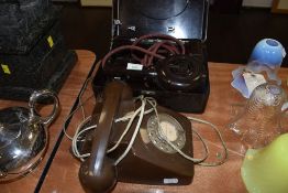 A vintage bakelite Ormond E1022 hairdryer in original bakelite box and a rotary dial BT telephone.