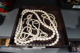 A small selection of beads including mother of pearl, Honora baroque pearls, amethyst style tear