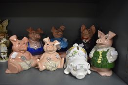 A selection of ceramic money box or piggy bank by Wade for Nat West