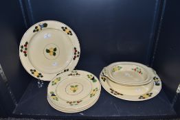 A selection of dinner and serving plates by Adams in the hand decorated Titan ware design