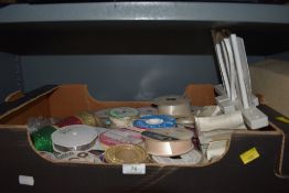 A selection of of haberdashery sewing and dress making ribbons and silks