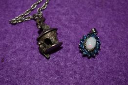 An opal and sapphire style stone cluster pendant set in white metal stamped 925 and a white metal