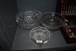 A selection of clear cut crystal glass wares including heavy cut bowls and footed tazza