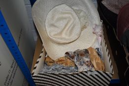 A box of retro scarves and a hat, some handkerchiefs and similar.