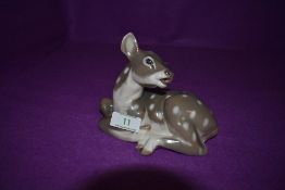 A Royal Copenhagen study, Recumbent Fawn, model no. 2609, width 15cm