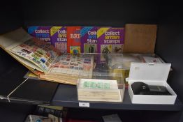 A selection of stamp and similar philatelic ephemera including albums