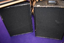 A pair of monitor wedge speakers