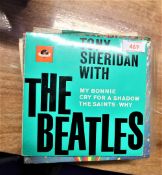 A collection of Beatles 7' singles including rare foreign pressing and rare picture sleeves.