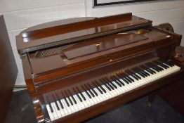 A traditional mahogany cased baby grand piano , labelled Dagmar