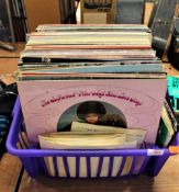 A box of various albums and 7' singles.