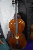A traditional cello, labelled Rosetti (tatra) Stradivarius model