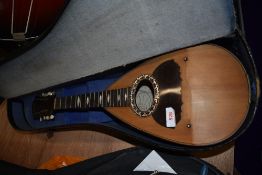 A late 19th/early 20th Century bowkl back mandolin, labelled for Guiseppe Vinaccia, with traditional
