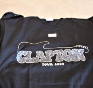 A lot of T shirts including Eric Clapton, queen, Eagles and more.