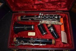 A 'Graduate' clarinet, made for Ruddal, Carte & Co , in original burgundy case, with plush lining
