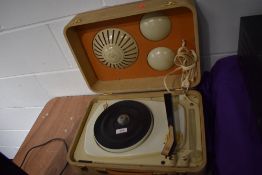 An unusual portable record player and speaker set by Radialva in cream and orange case