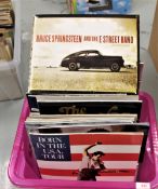 A large box of programmes and related material.