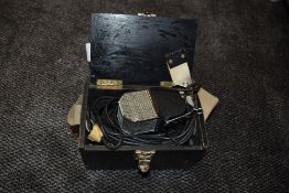 A vintage E.M.I model number 2351E ribbon microphone with wooden box.