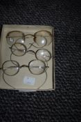 Three pairs of vintage spectacles,two having silver tone frames and one pair gold tone.