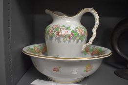 A late 19th century Cauldon wash stand set, having transfer floral pattern ad gilt detailing.